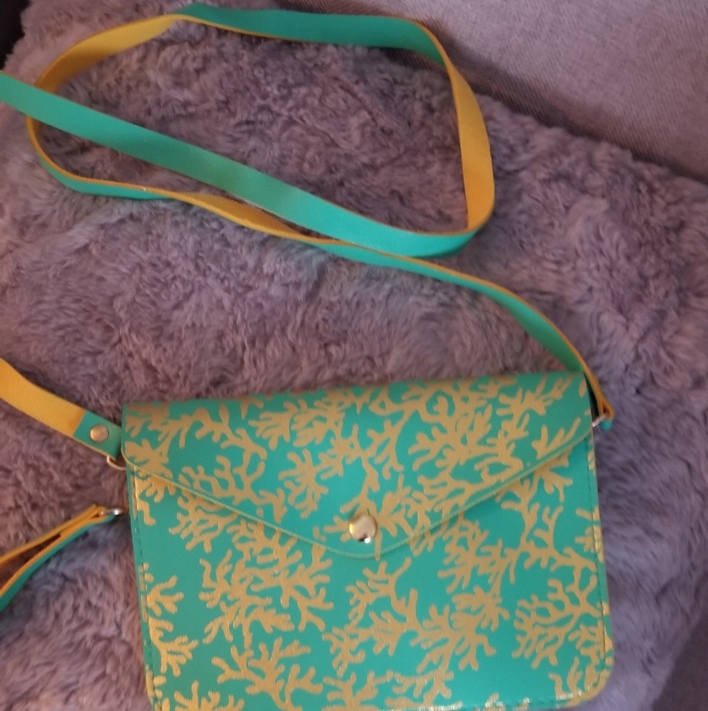 Boutique purse with full strap and wristlet strap.